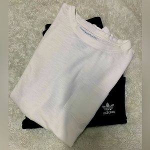 White T-shirt and black shorts, 11 to 12 in boy size.
